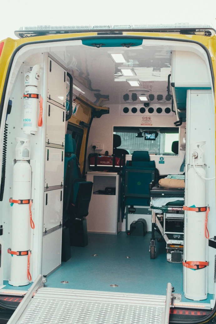 Interior view of an ambulance with medical equipment and stretcher